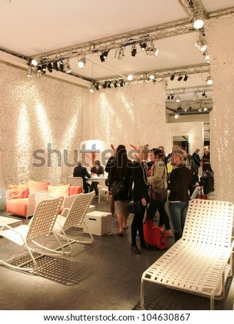 MILAN - APRIL 13: People look at home interior design solutions during Salone del Mobile, international furnishing accessories exhibition on April 13, 2011 in Milan, Italy.