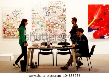 MILAN - MARCH 27: People visit work of arts galleries during MiArt ArtNow, international exhibition of modern and contemporary art March 27, 2010 in Milan, Italy.