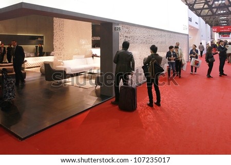 MILAN - APRIL 17: People visit interior design pavilions at Salone del Mobile, international furnishing accessories exhibition on April 17, 2012 in Milan, Italy.