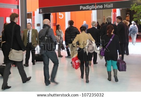 MILAN - APRIL 17: People enter Salone del Mobile, international furnishing accessories exhibition on April 17, 2012 in Milan, Italy.