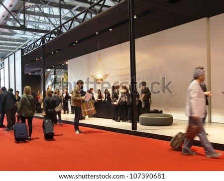 MILAN - APRIL 17: People visit interior design pavillions at Salone del Mobile, international furnishing accessories exhibition on April 17, 2012 in Milan, Italy.