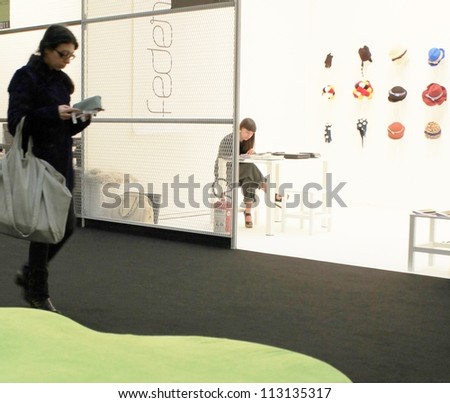 MILAN, ITALY - FEBRUARY 26: People visit accessories and clothes collections at Milano fashion design week February 26, 2010 in Milan, Italy.