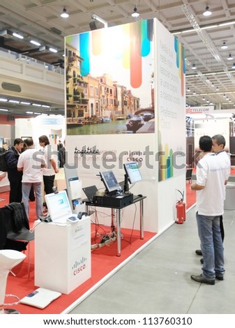 MILAN, ITALY - OCT. 19: People visiting Cisco technologies area during SMAU, international fair of business intelligence and information technology October 19, 2011 in Milan, Italy.