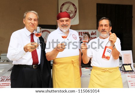 MANTOVA, ITALY - JUNE 13: People tasting wines during Golosaria, fair show of food and gastronomy culture June 13, 2010 in Mantova, Italy.