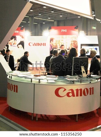 MILAN, ITALY - OCT. 19: People visit Canon technologies exhibition area at SMAU, international fair of business intelligence and information technology October 19, 2011 in Milan, Italy.