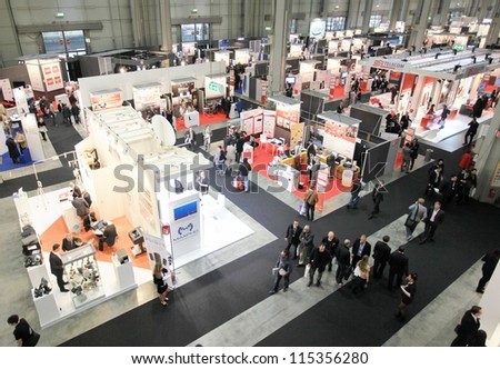 MILAN, ITALY - OCT. 19: People visit technologies exhibition area at SMAU, international fair of business intelligence and information technology October 19, 2011 in Milan, Italy.
