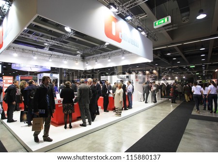 MILAN, ITALY - OCTOBER 17: People visit Olivetti technologies products area at SMAU, international fair of business intelligence and information technology October 17, 2012 in Milan, Italy.