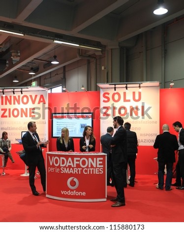 MILAN, ITALY - OCTOBER 17: People at Vodafone technologies products area at SMAU, international fair of business intelligence and information technology October 17, 2012 in Milan, Italy.