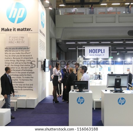 MILAN, ITALY - OCTOBER 17: People visit HP technology products exhibition area at SMAU, international fair of business intelligence and information technology October 17, 2012 in Milan, Italy.