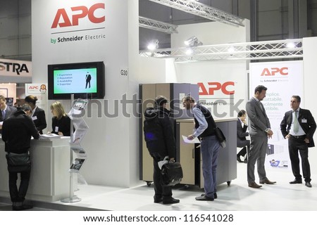MILAN, ITALY - OCTOBER 17: People visit APC technology products exhibition area at SMAU, international fair of business intelligence and information technology October 17, 2012 in Milan, Italy.