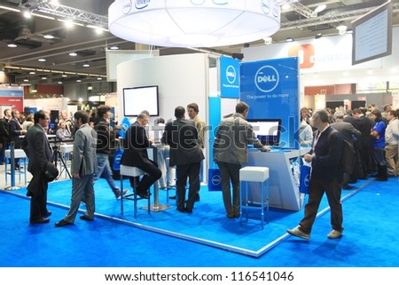 MILAN, ITALY - OCTOBER 17: People visit Intel technology products exhibition area at SMAU, international fair of business intelligence and information technology October 17, 2012 in Milan, Italy.