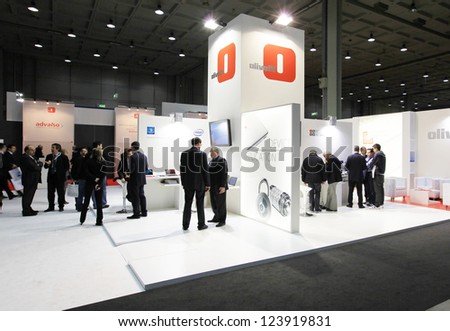 MILAN, ITALY - OCT. 20: People visit Olivetti products stands at SMAU, international fair of business intelligence and information technology October 20, 2010 in Milan, Italy.