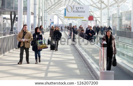 MILAN, ITALY - JAN 24: People on the tapis roulant enter Macef, International Home Show Exhibition on January, 24 2013 in Milan, Italy.