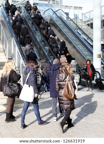 MILAN, ITALY - JAN 24: People on the elevator enter home accessories and furnishing stands at Macef, International Home Show Exhibition January 24, 2013 in Milan, Italy.