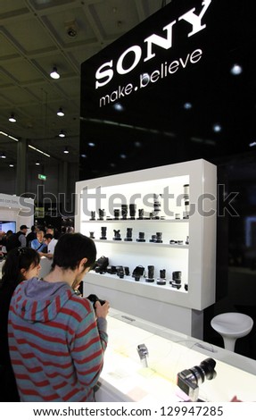 MILAN, ITALY - MARCH 26: People visit Sony stand looking for cameras and lenses during PHOTOSHOW, International Photo and Digital Imagin Exhibition on March 26, 2011 in Milan, Italy.