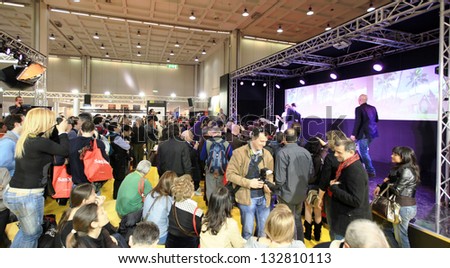 MILAN, ITALY - MARCH 26: People visit stands exhibition area at PHOTOSHOW, International Photo and Digital Imaging Exhibition on March 26, 2011 in Milan, Italy.
