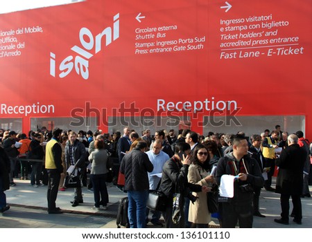 MILAN - APRIL 10: People crowd entering Salone del Mobile, international home furnishing design and accessories exhibition on April 10, 2013 in Milan, Italy.