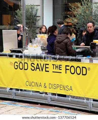 MILAN, ITALY - APRIL 12: People during a break at God Save the Food area during Fuorisalone Milano Design week April 12, 2013 in Milan, Italy.