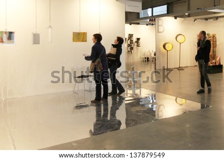 MILAN - APRIL 07: People visit paintings gallery at MiArt, international exhibition of modern and contemporary art April 07, 2013 in Milan, Italy.