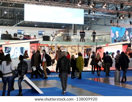 MILAN, ITALY - FEBRUARY 15: People visit tourism exhibition stands Italy tourism area at BIT, International Tourism Exchange Exhibition on February 15, 2013 in Milan, Italy.