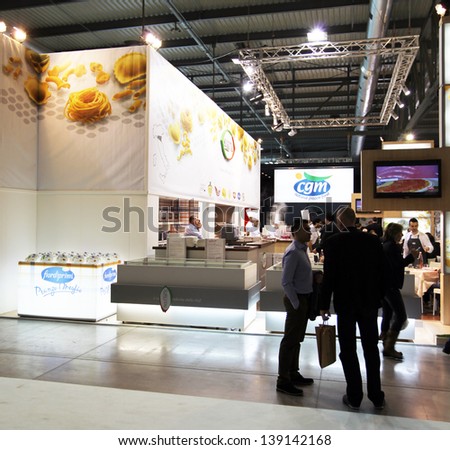 MILAN, ITALY - MAY 20: People visit local food productions exhibition stands at Tuttofood, Milano World Food Exhibition May 20, 2013 in Milan, Italy.