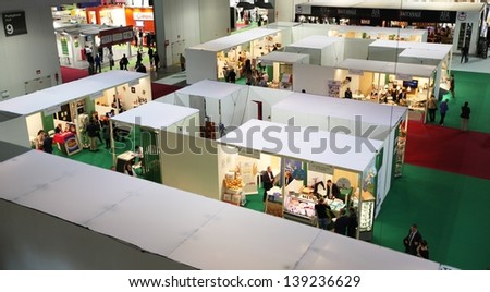 MILAN, ITALY - MAY 20: Panoramic view of people visiting the food productions exhibition stands at Tuttofood, Milano World Food Exhibition May 20, 2013 in Milan, Italy.