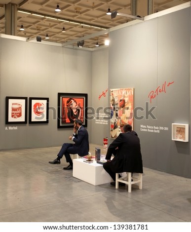 MILAN - APRIL 07: People look at paintings at MiArt, international exhibition of modern and contemporary art April 07, 2013 in Milan, Italy.