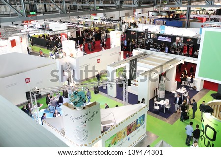 MILAN, ITALY - MAY 20: Panoramic view of people visiting local and national food productions exhibition area at Tuttofood, Milano World Food Exhibition May 20, 2013 in Milan, Italy.