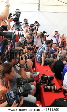 VENICE - SEPTEMBER 7: Photographers at work on the red carpet at 69th Venice Film Festival on September 7, 2012 in Venice, Italy.