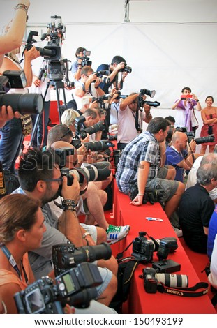 VENICE - SEPTEMBER 8: Photographers at work on the Red Carpet at 69th Venice Film Festival on September 8, 2012 in Venice, Italy.