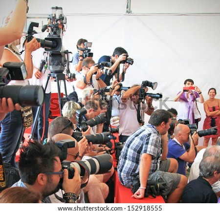 VENICE - SEPTEMBER 8: Photographers at work on the Red Carpet at 69th Venice Film Festival on September 8, 2012 in Venice, Italy.