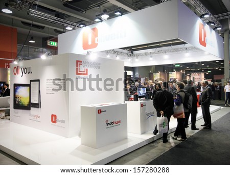MILAN, ITALY - OCTOBER 17: People visit Olivetti technology products exhibition area at SMAU, international fair of business intelligence and information technology October 17, 2012 in Milan, Italy.