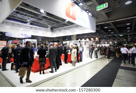 MILAN, ITALY - OCTOBER 17: People visit Olivetti technology products exhibition area at SMAU, international fair of business intelligence and information technology October 17, 2012 in Milan, Italy.