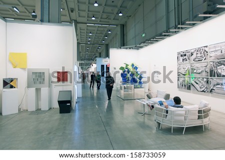 MILAN - APRIL 08: People look at paintings galleries during MiArt, international exhibition of modern and contemporary art on April 08, 2011 in Milan, Italy