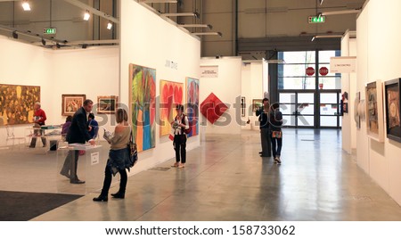 MILAN - APRIL 08: Women look at paintings galleries during MiArt, international exhibition of modern and contemporary art on April 08, 2011 in Milan, Italy
