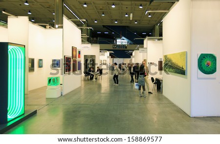 MILAN - APRIL 08: People walk trough paintings galleries during MiArt, international exhibition of modern and contemporary art on April 08, 2011 in Milan, Italy
