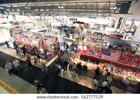 MILAN, ITALY - NOVEMBER 7: Panoramic view of people visiting motorcycles exhibition area at EICMA, 71st International Motorcycle Exhibition on November 7, 2013 in Milan, Italy.