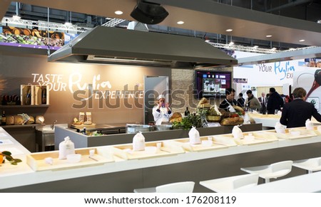 MILANO, ITALY - FEBRUARY 16, 2012: Tasting food products at Puglia regional exhibition area at BIT, International Tourism Exchange Exhibition in Milan, Italy.