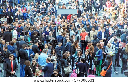 MILANO, ITALY - APRIL 10, 2013: People crowd enter Salone del Mobile, international furnishing accessories exhibition at Rho Fiera Center in Milano, Italy.