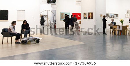 MILANO, ITALY - APRIL 07, 2013: People look at paintings and sculpture galleries at MiArt, international exhibition of modern and contemporary art April 07, 2013 in Milan, Italy.