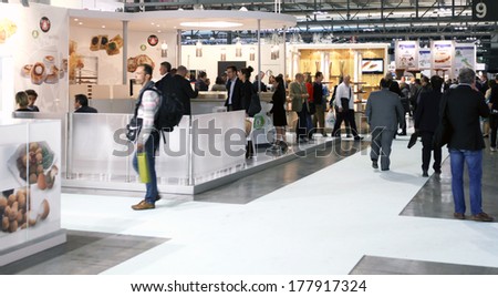 MILANO, ITALY - MAY 20, 2013: People visit food productions exhibition stands at Tuttofood, Milano World Food Exhibition in Milan, Italy.