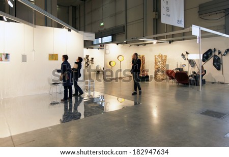MILANO, ITALY - APRIL 07, 2013: People visit a paintings gallery at MiArt, international exhibition of modern and contemporary art in Milano, Italy.