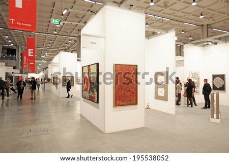 MILANO, ITALY - APRIL 08, 2011: People look at paintings galleries during MiArt, international exhibition of modern and contemporary art in Milano, Italy