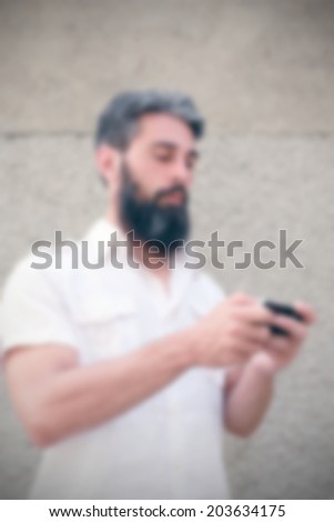 man with smart phone, intentionally blurred portrait