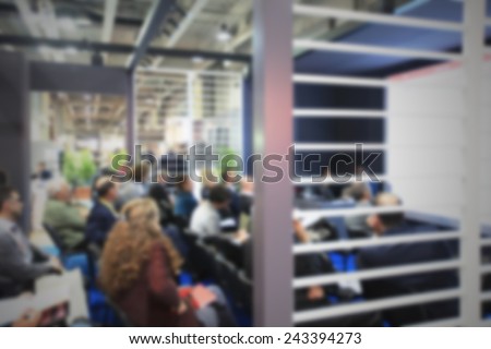 People during a conference meeting. Intentionally blurred post production.