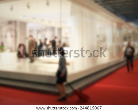 Trade show background. Intentionally blurred post production. Humans not recognizable.