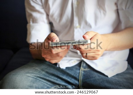 Smart phone in man\'s hands, people and technology background.