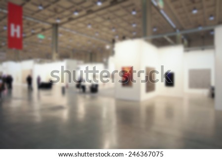 Art gallery generic background, location and humans not recognizable. Intentionally blurred background.
