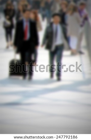 Business men walk. Intentionally blurred post production.
