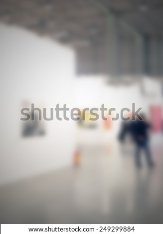 Art gallery generic background. Intentionally blurred post production, humans and location not recognizable.